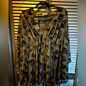 Sourpuss clothing mesh swimsuit coverup with skulls.